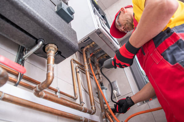 Technician calbirates gas detection equipment.