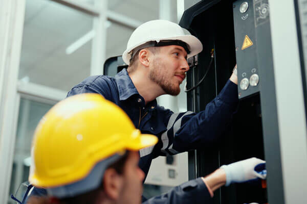 Technicians installing equipment.